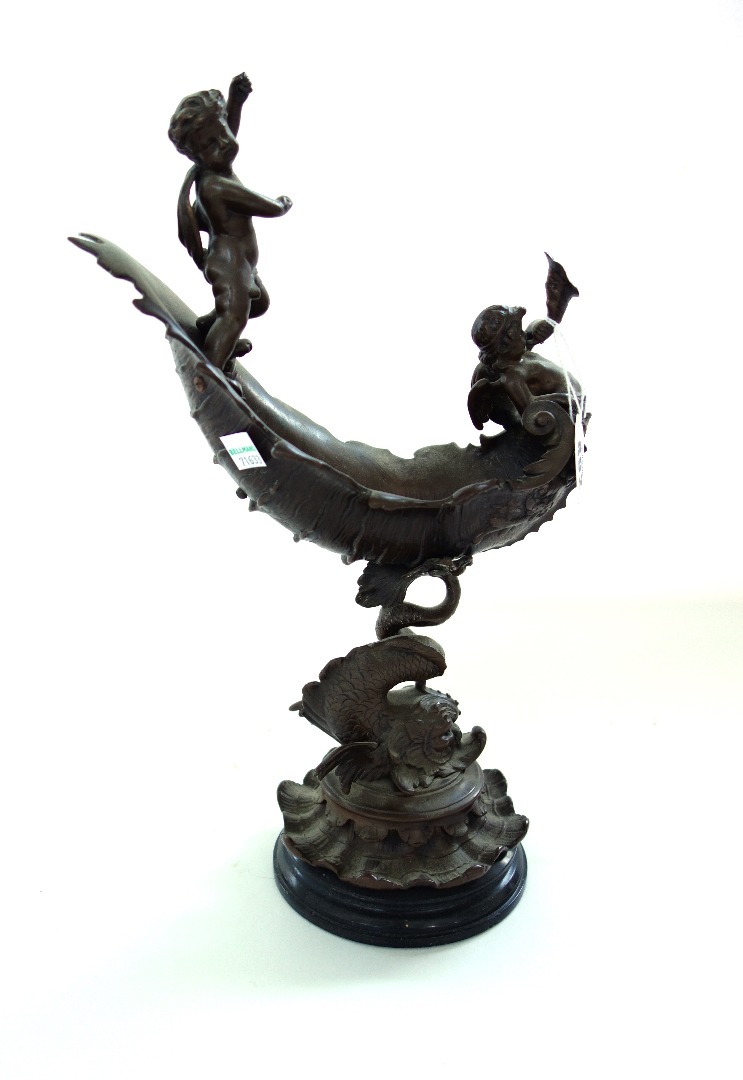 Appraisal: A patinated bronze dolphin centrepiece probably French late th century