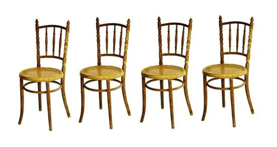 Appraisal: Four Fischel side chairs cane seating turned spindles and stiles