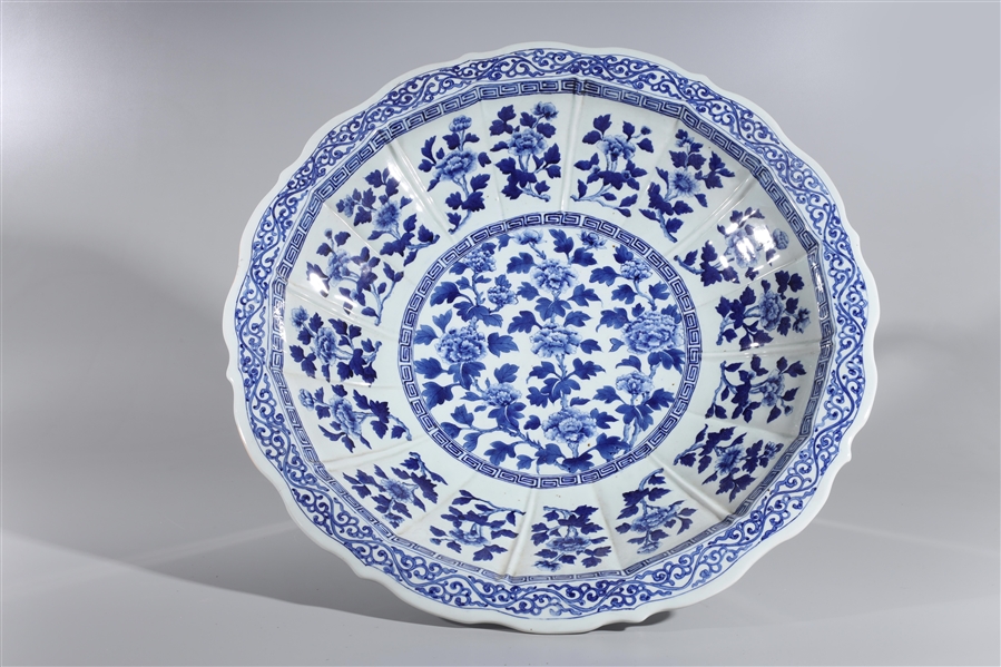 Appraisal: Large Chinese blue and white porcelain charger with floral motifs