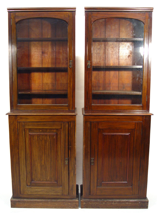 Appraisal: Pair of Victorian rosewood and mahogany bookcases each fitted with