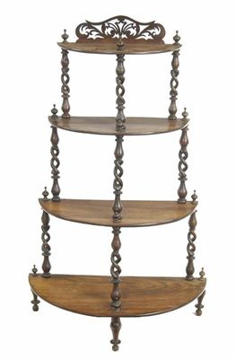 Appraisal: A Victorian rosewood four tier etagere with pierced spiral twist