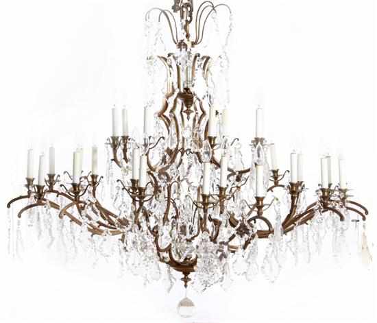 Appraisal: Continental bronze and crystal thirty-two light chandelier configuration of short