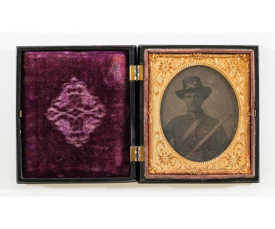 Appraisal: Tintype of a Civil War Union soldier holding a musket