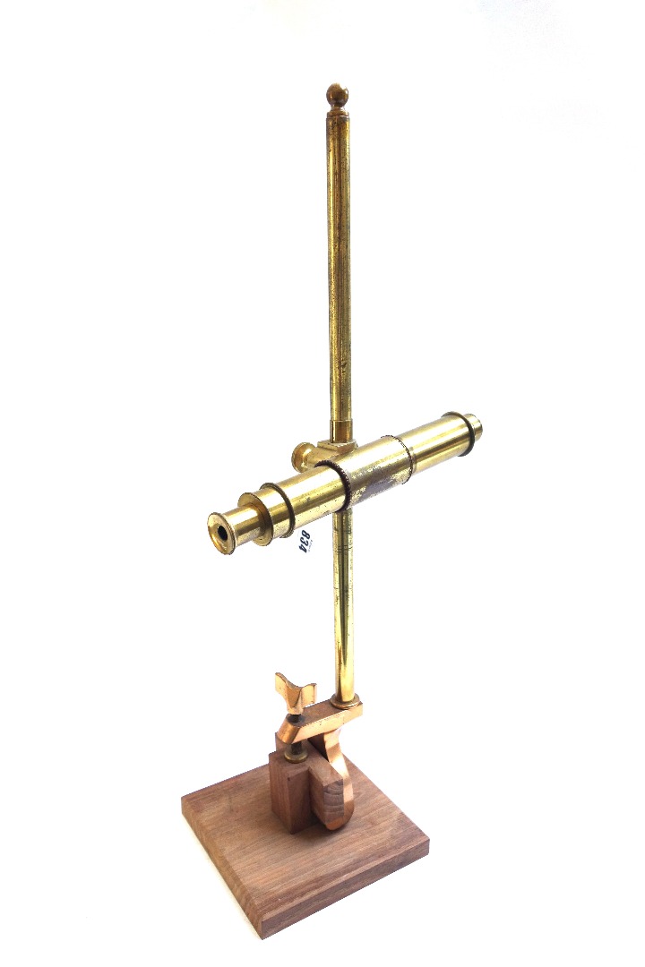 Appraisal: A brass monocular microscope th century of single tube construction