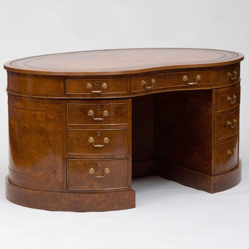 Appraisal: VICTORIAN STYLE LEATHER-INSET BURL WALNUT KIDNEY-SHAPED DESK Fitted with a