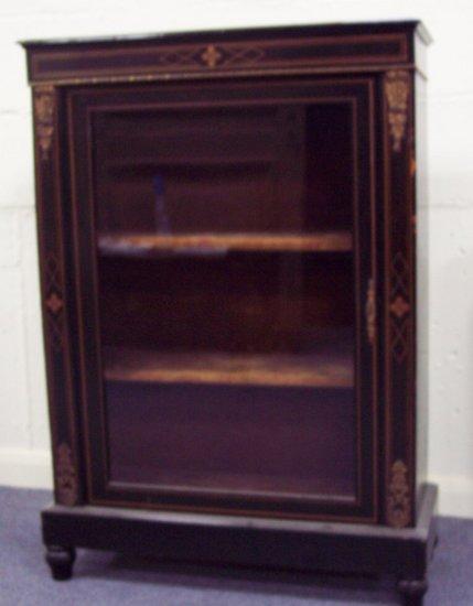 Appraisal: A Victorian ebony and ebonised cabinet inlaid stringing and with