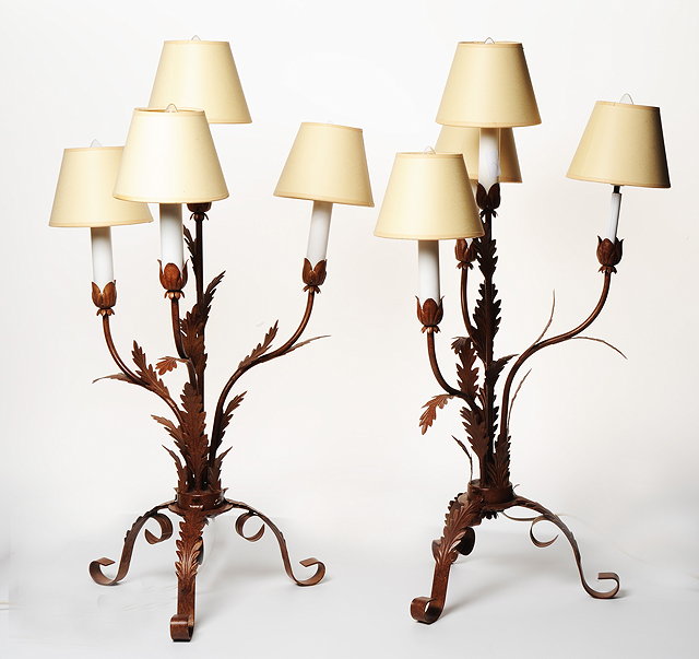 Appraisal: A PAIR OF PAINTED WROUGHT IRON FOUR LAMP TABLE LIGHTS