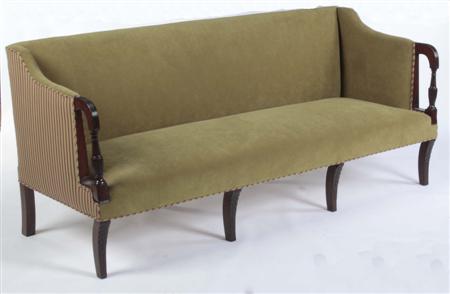 Appraisal: A Regency mahogany framed sofa the upholstered rectangular back and