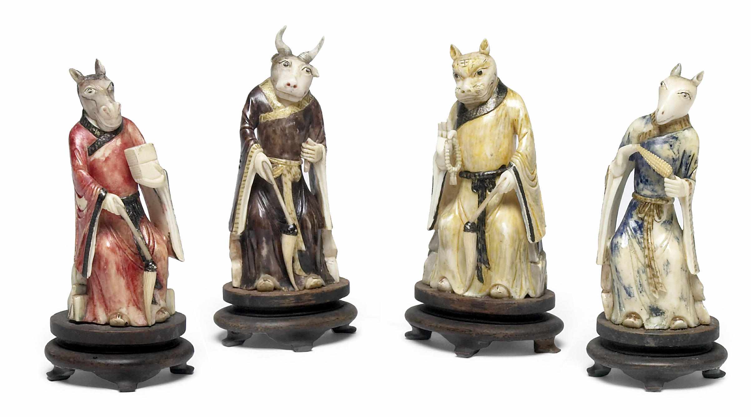 Appraisal: A group of four small Chinese polychromed ivory Zodiac figures