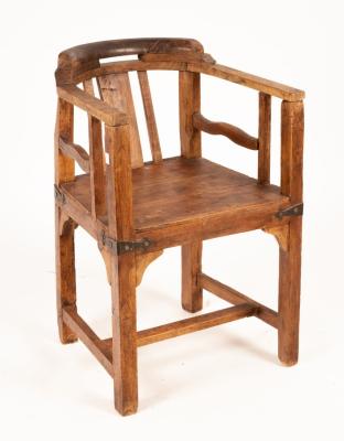 Appraisal: A rustic elm chair of tub shape metal mounted and