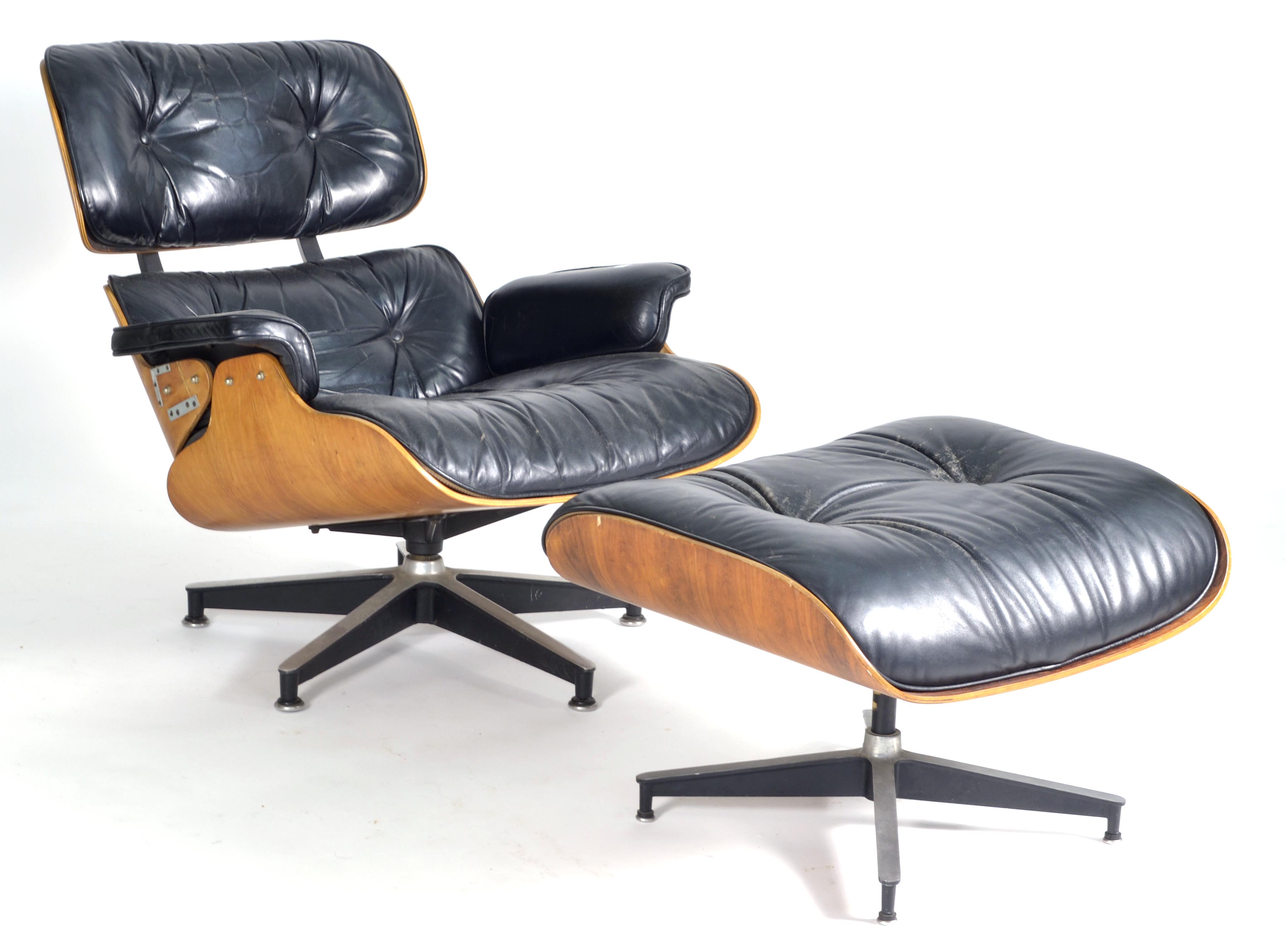 Appraisal: CHARLES EAMES-DESIGN LOUNGE CHAIR with ottoman In black leather upholstery