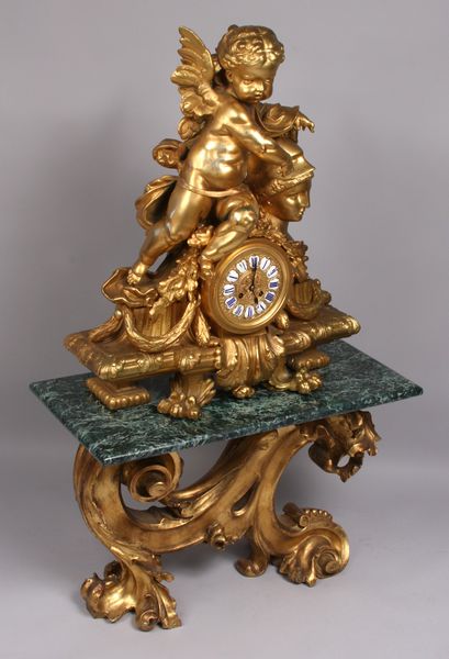 Appraisal: th Century continental bronze clock with cherub on marble top