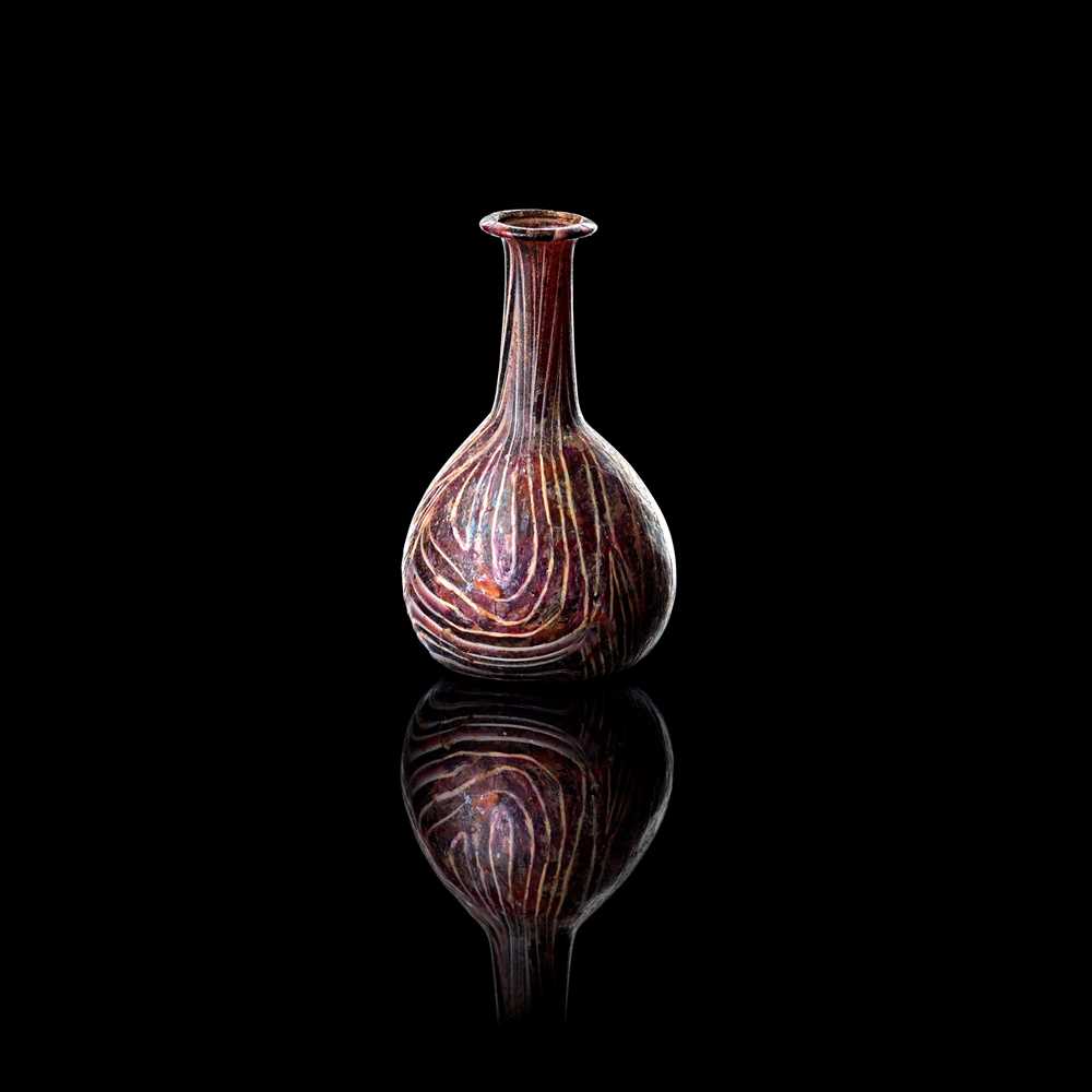 Appraisal: ROMAN GLASS PERFUME BOTTLE ST CENTURY A D translucent purple