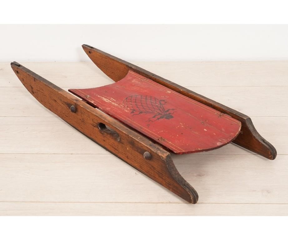 Appraisal: Wood child's sled painted red with stenciled hot air balloon