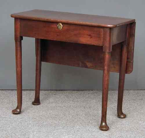 Appraisal: A George II ''Cuban'' mahogany rectangular tea table with drop