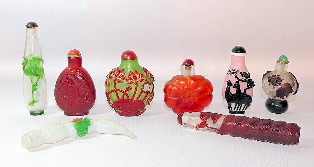 Appraisal: Eight Peking Glass Snuff Bottles Eight Peking glass snuff bottles