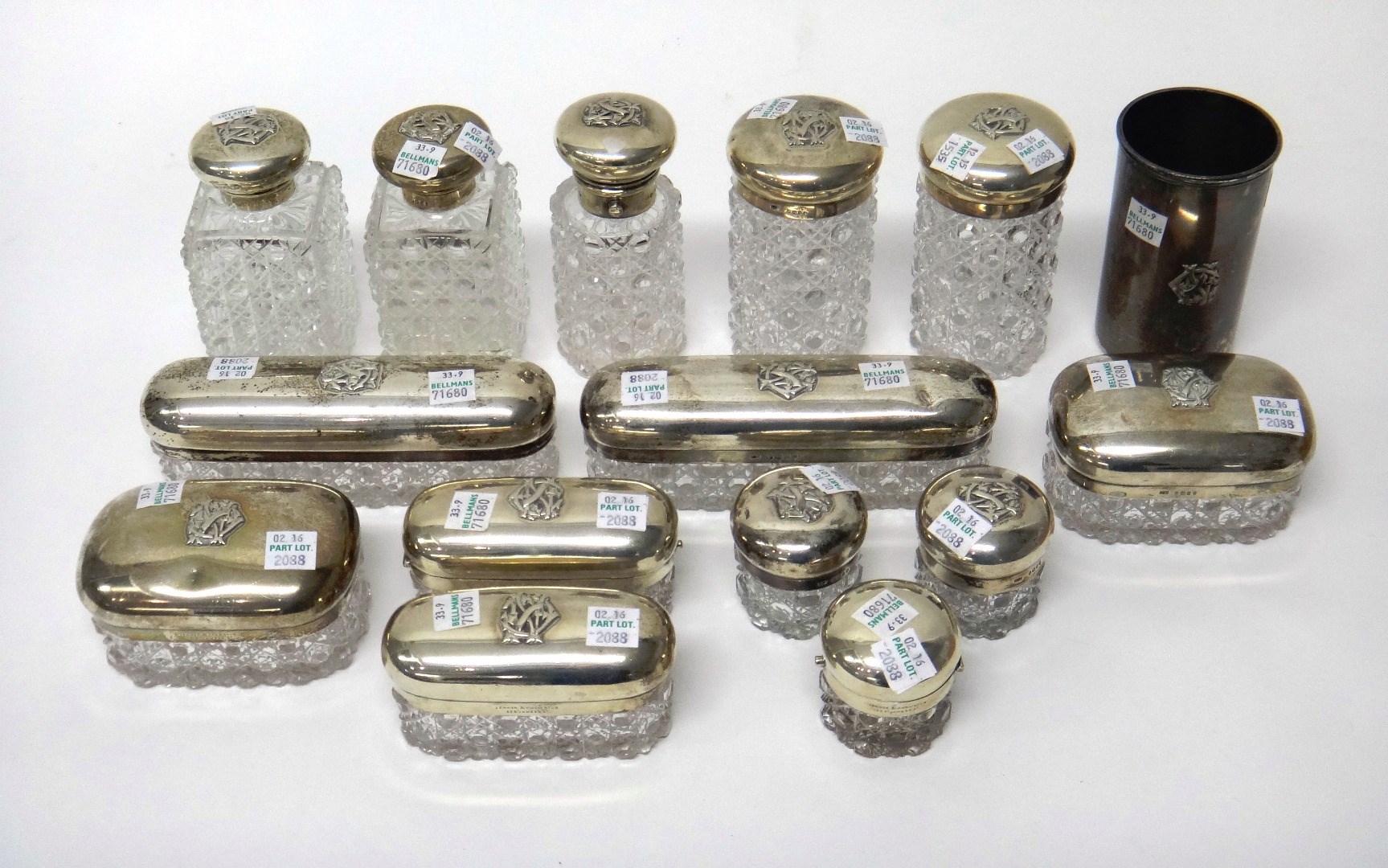 Appraisal: Fourteen Victorian silver mounted cut glass toilet bottles boxes and