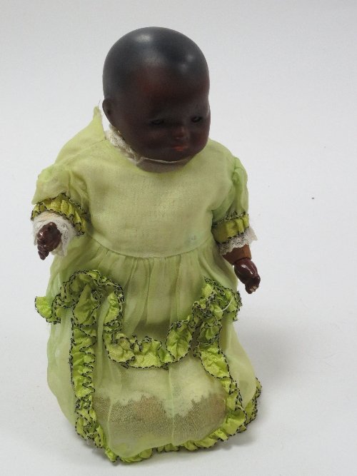 Appraisal: An Armand Marseille bisque head brown doll with weighted eyes