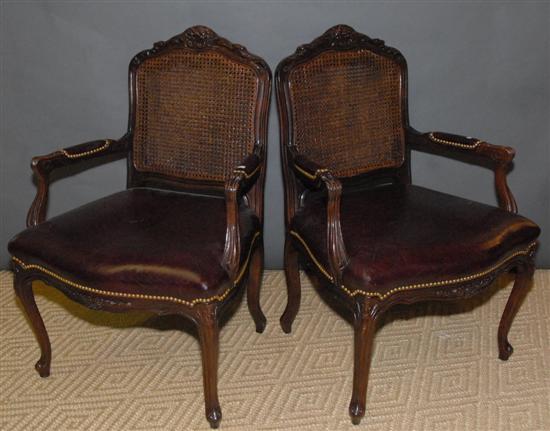 Appraisal: PAIR LOUIS XV-STYLE MAHOGANY FAUTEUILS With cane backs Provenance From