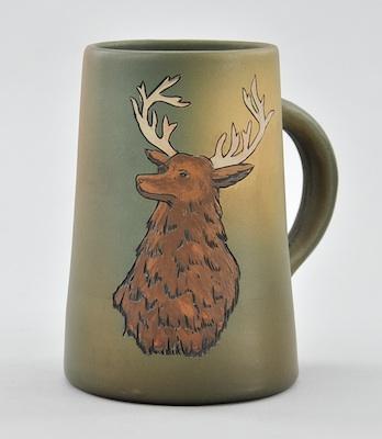 Appraisal: A Weller Dickensware Mug With a gray-green background and with