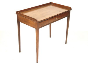 Appraisal: A Georgian mahogany side table the raised three quarter gallery