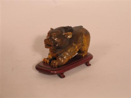 Appraisal: Chinese tiger-eye crimera figure th century Carved standing low on