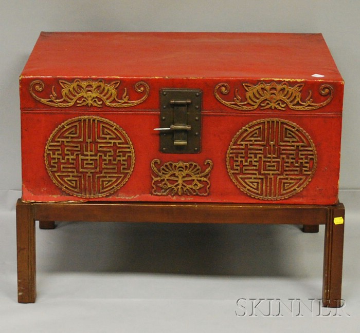 Appraisal: Chinese Export Gilt and Red-painted Pigskin-clad Trunk on Wooden Stand