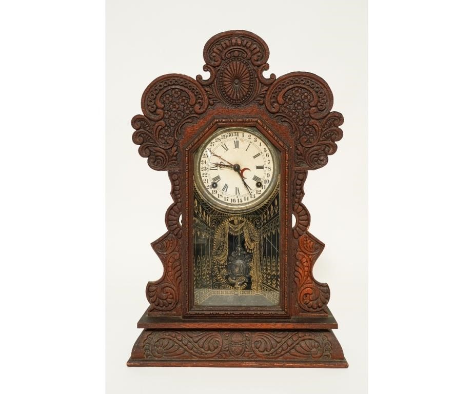 Appraisal: E Ingraham Co oak gingerbread calendar clock with key h