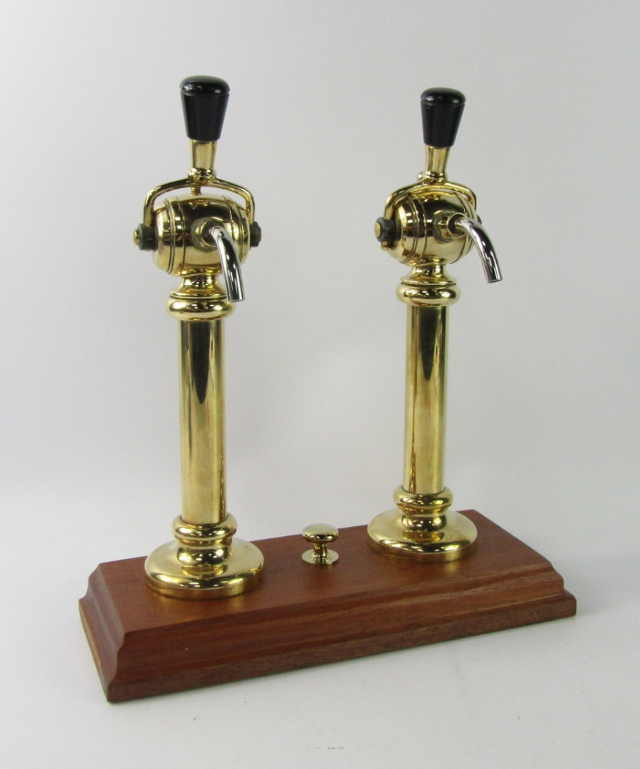 Appraisal: A pair of Guinness brass beer pump taps on a