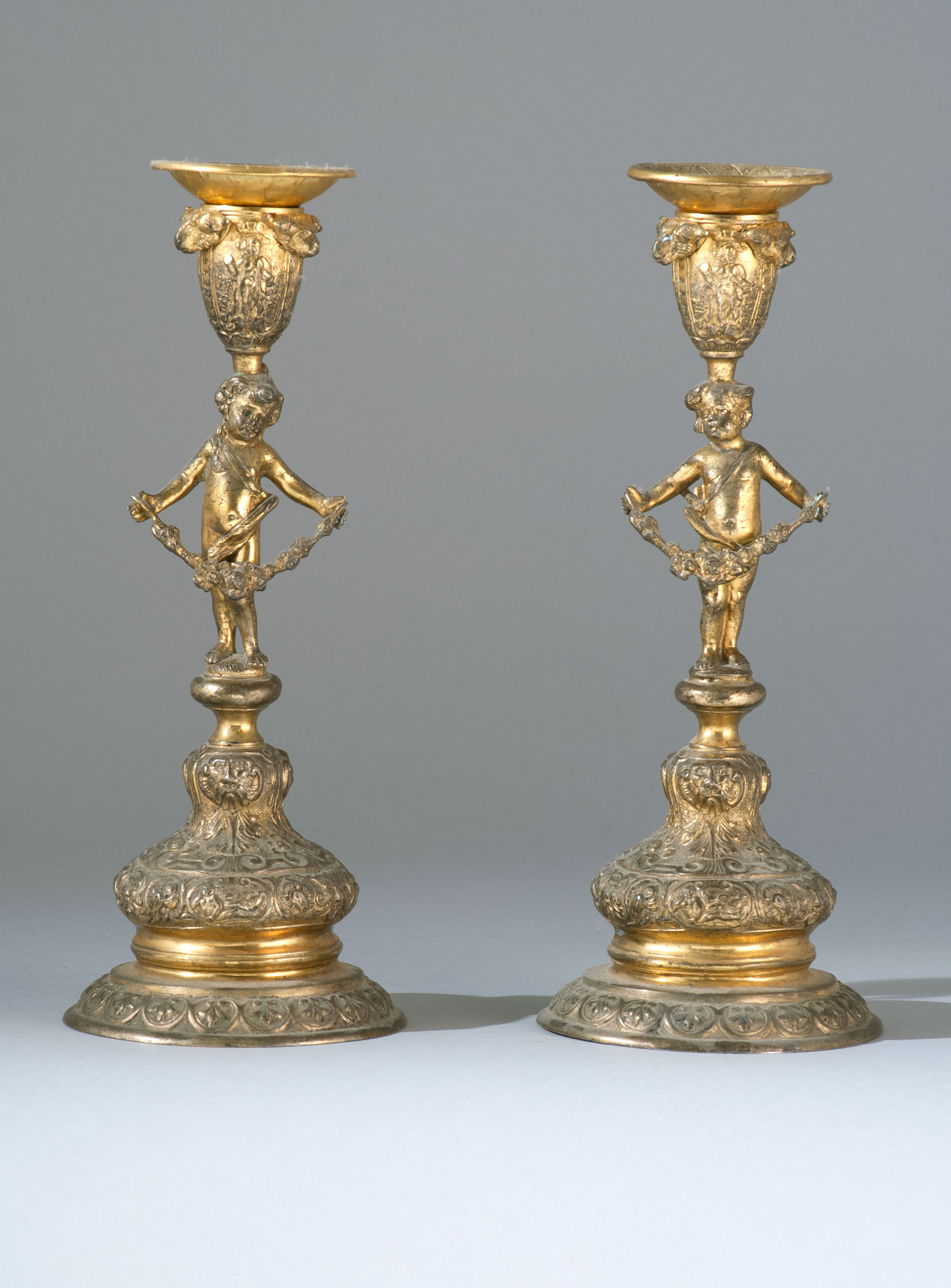 Appraisal: PAIR OF CONTINENTAL BRASS CANDLESTICKS Late th CenturyIn the form