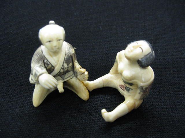 Appraisal: pc Carved Ivory Erotic Figurine Set man woman fancy polychrome