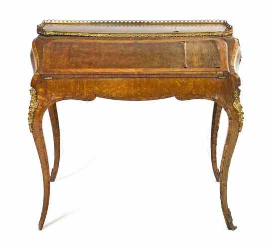 Appraisal: An English Maple Lady's Writing Desk having a three-quarter gallery