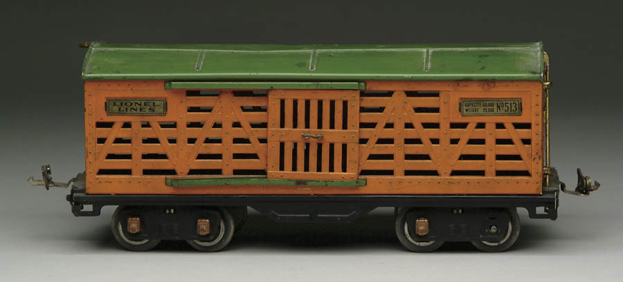 Appraisal: LIONEL STANDARD GAUGE CATTLE CAR Orange sides with green roof