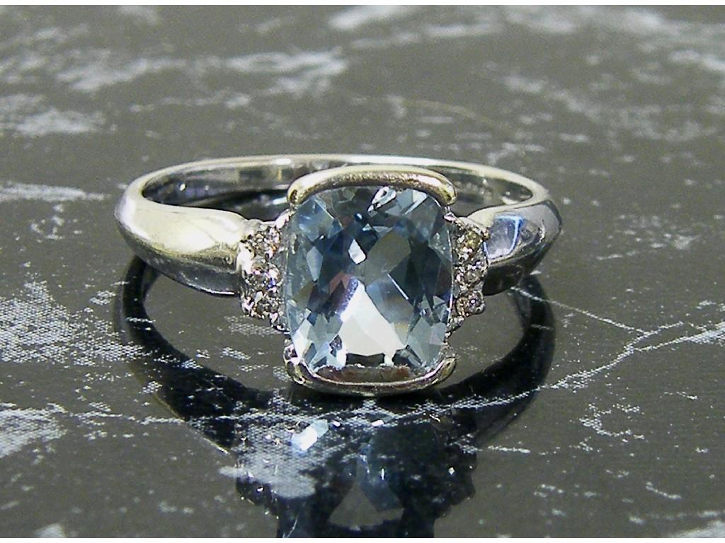 Appraisal: ct white gold blue topaz and diamond dress ring size