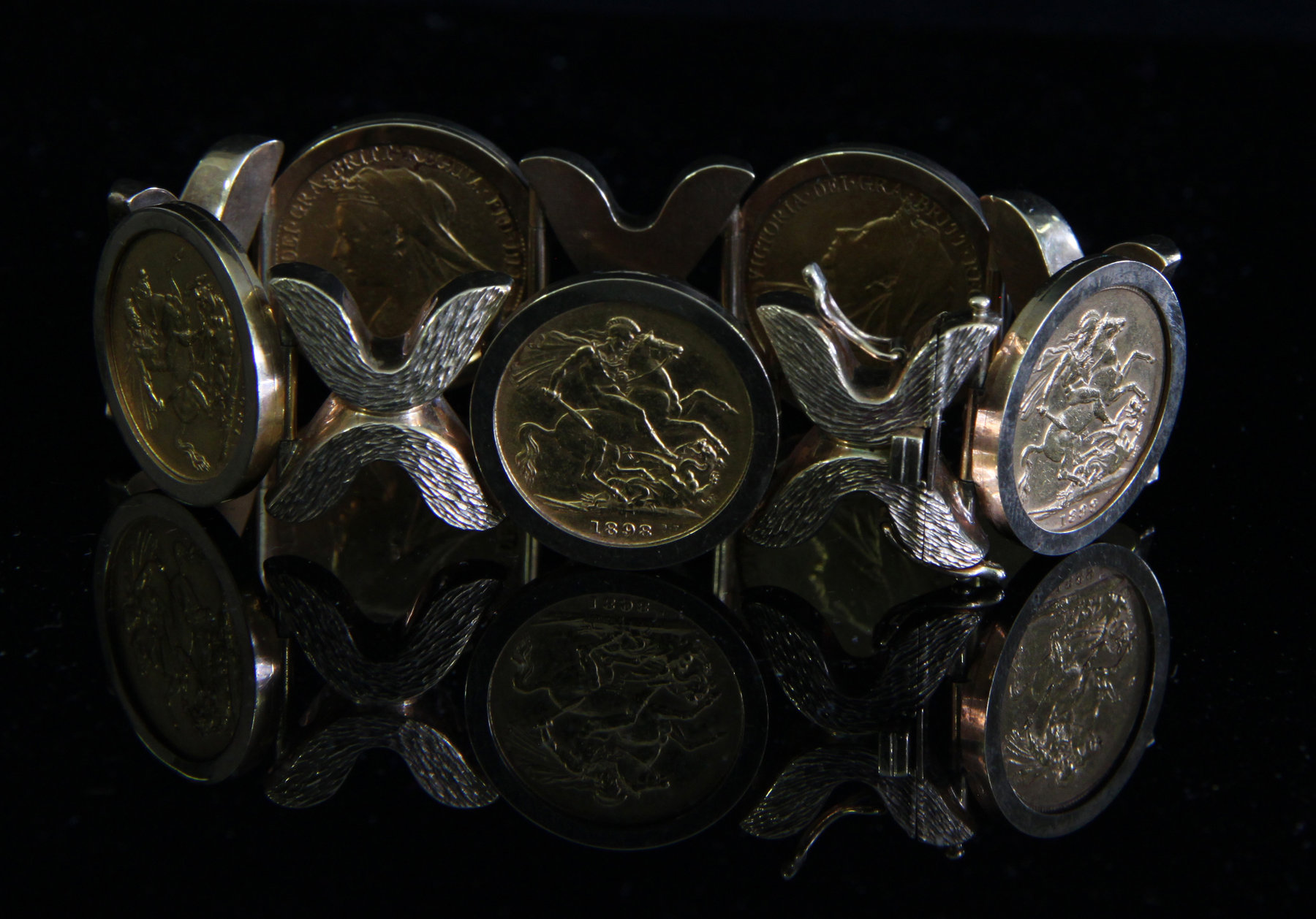 Appraisal: A ct gold bracelet set with five gold sovereigns the