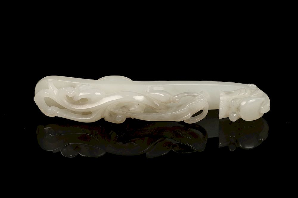 Appraisal: CHINESE WHITE JADE DRAGON BELT HOOK The semi-translucent white jadeite