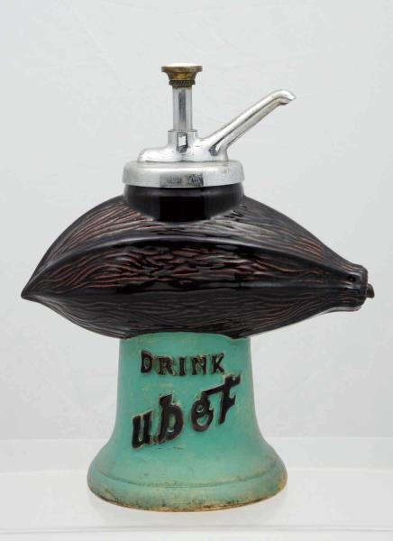 Appraisal: Ubet Figural Dispenser Original Pump The pump top cap is