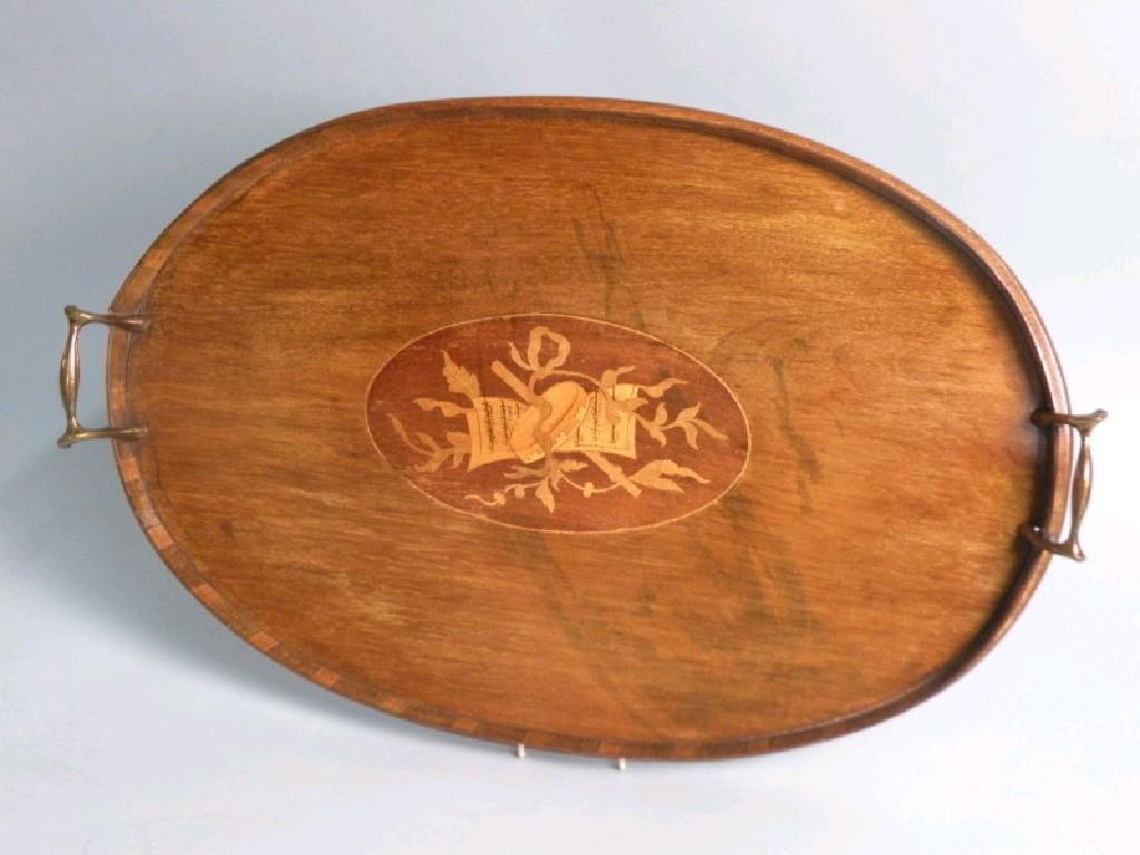 Appraisal: An Edwardian mahogany oval tray with a chequer banded raised