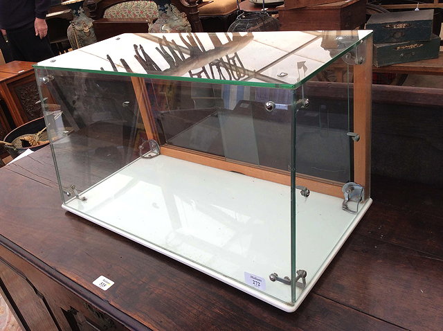 Appraisal: A SEAL GLASS TABLE TOP DISPLAY CABINET cm high x