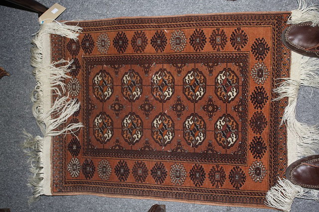 Appraisal: A SMALL AFGHAN BOKHARA STYLE RUG with central panel of