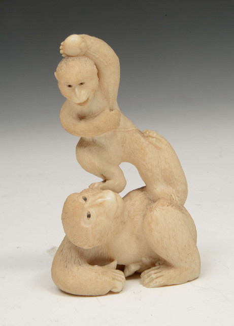 Appraisal: A JAPANESE CARVED IVORY OKIMONO in the form of a