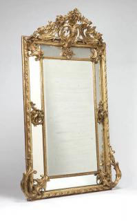 Appraisal: A large carved giltwood wall mirror Late th century the