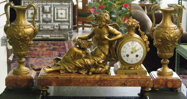 Appraisal: A FRENCH THREE PIECE FIGURAL CLOCK AND GARNITURE SET the