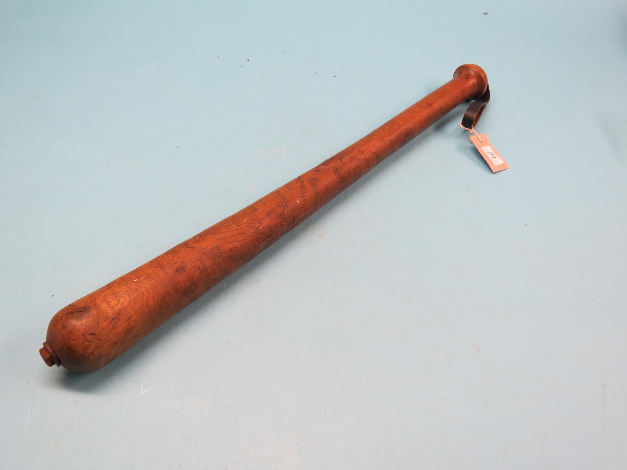 Appraisal: A solid yew cosh with attached leather grip in