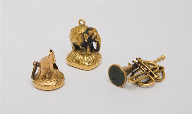 Appraisal: GROUP OF K GOLD AND HARDSTONE CHARMS Comprising an elephant