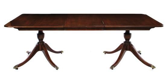 Appraisal: Sheraton style mahogany double-pedestal dining table rectangular top with rounded