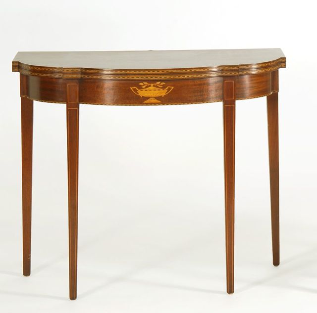 Appraisal: HEPPLEWHITE-STYLE MODIFIED-DEMILUNE CONSOLE CARD TABLE In mahogany Label of Charak