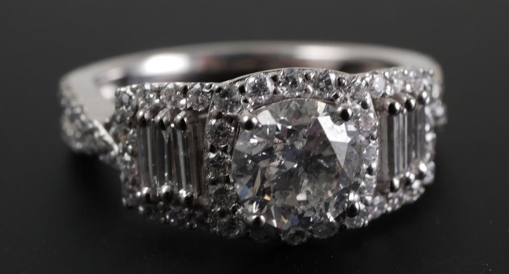 Appraisal: Set in platinum ring features round and baguette diamonds supported