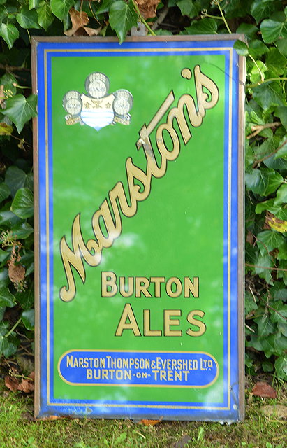 Appraisal: A MARSTON'S BURTON ALES REVERSE GLASS ADVERTISING SIGN with green