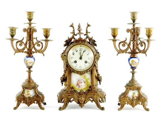 Appraisal: French porcelain-inset metal clock garniture circa floral and swag encrusted